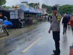 Cuaca tak Bersahabat, Personel Polsek Bambalamotu Tetap Gatur Lalin