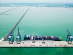 Kuala Tanjung, Transhipment di Bibir Selat Malaka